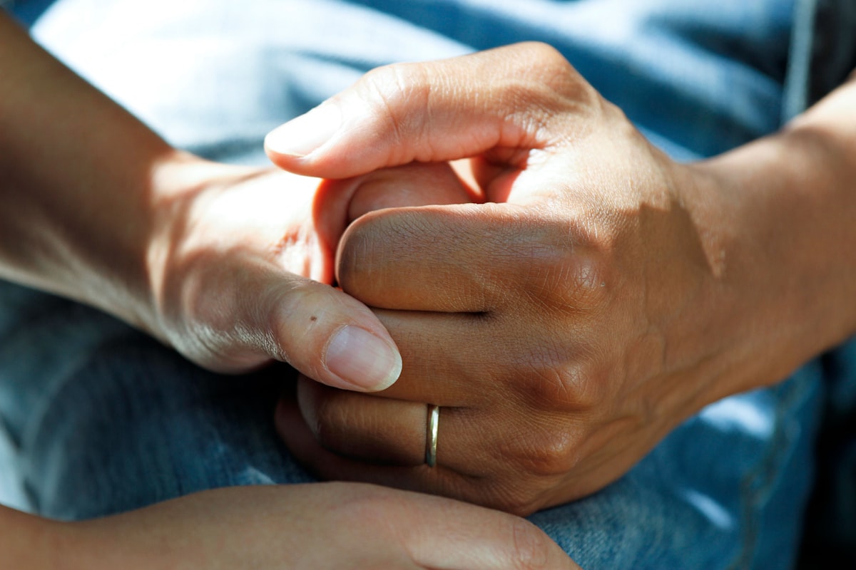 Caring hands representing first aid support